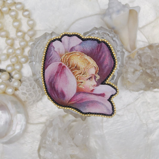 Broche fleur et tête