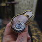 Broche main et coquillage
