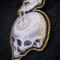 Broche memento mori