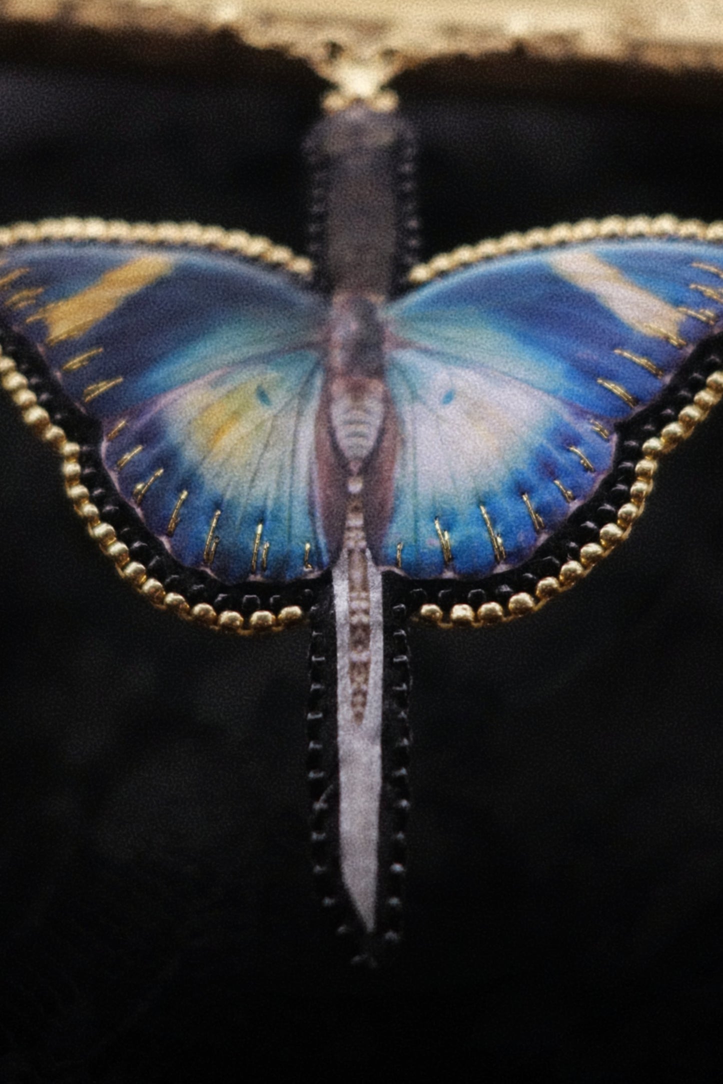 Collier papillon épée