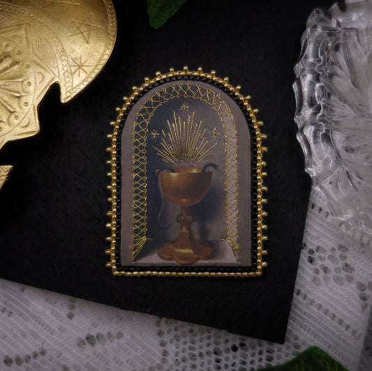Broche serpent dans un calice