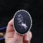 Broche fléau