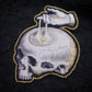 Broche memento mori