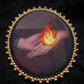 Broche mains et flamme
