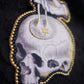 Broche memento mori