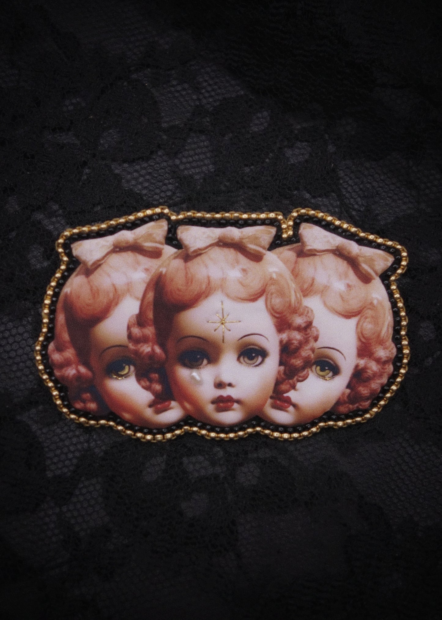 Broche triple tête