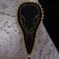Broche crâne de corbeau