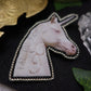 Broche licorne "eat the rich"