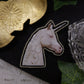 Broche licorne "eat the rich"