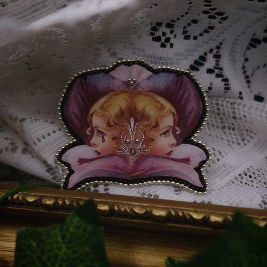 Broche double tête fleurie