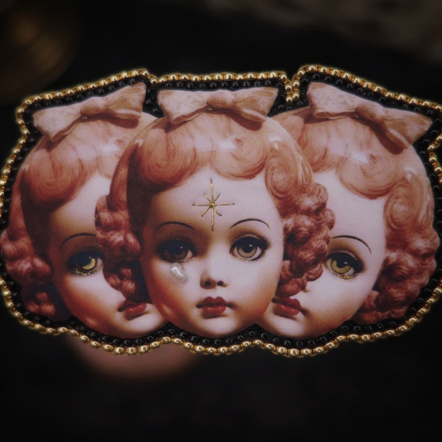 Broche triple tête